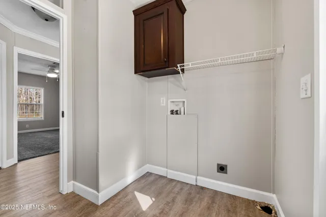 an empty room with wooden floor