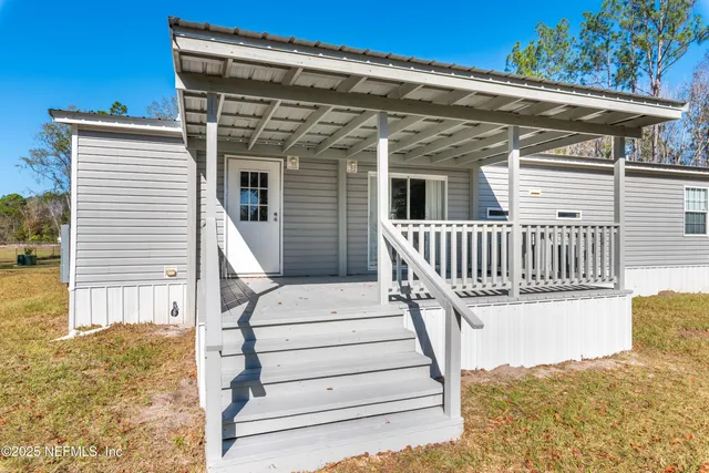 a view of a balcony with wooden floor