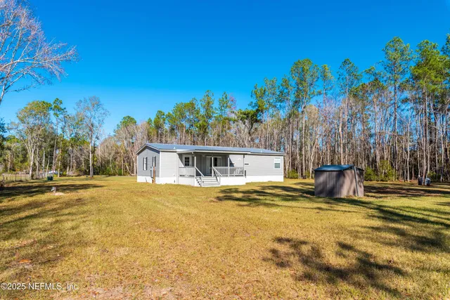 a view of a swimming pool with an outdoor space and seating area