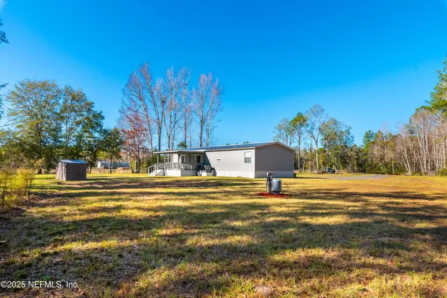 a view of a swimming pool with an outdoor space and seating area