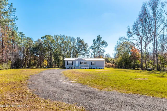 a view of a swimming pool with an outdoor space and seating area