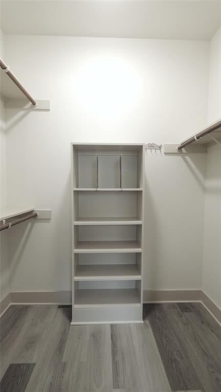 604 Allen Street, Unit 104 Austin, TX 78702 - Photo 10 of 16 a view of walk in closet with empty racks