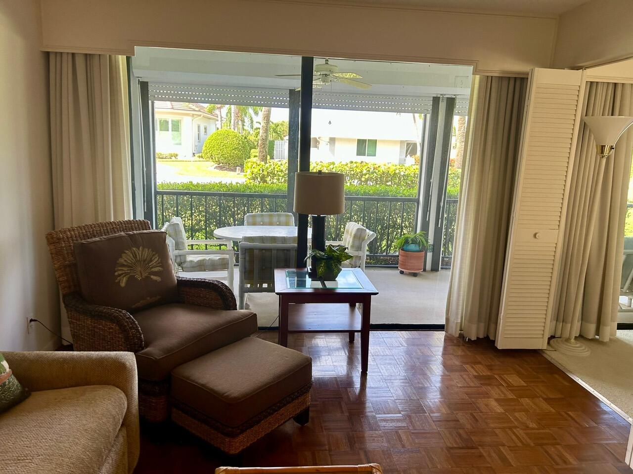 1 Southeast Turtle Creek Drive, Unit B Jupiter, FL 33469 - Photo 14 of 31 a living room with furniture and a window