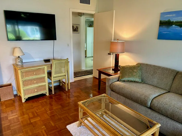 a bedroom with a bed and a lamp