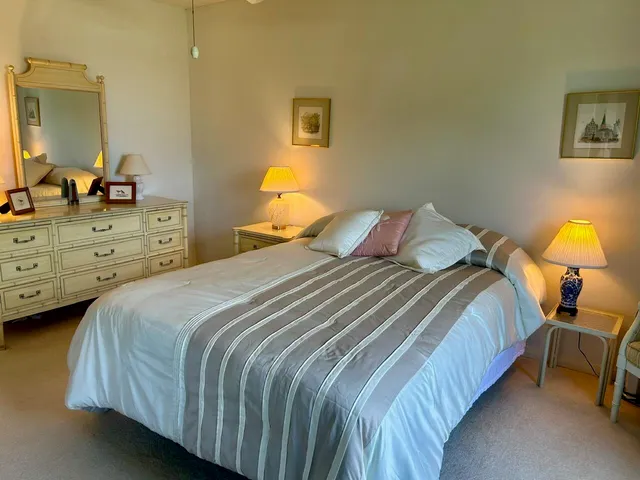 a bedroom with a bed and a dresser