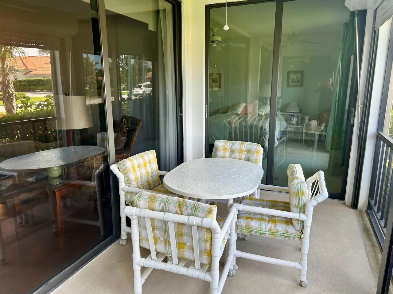 1 Southeast Turtle Creek Drive, Unit B Jupiter, FL 33469 - Photo 22 of 31 a dining room with furniture and window