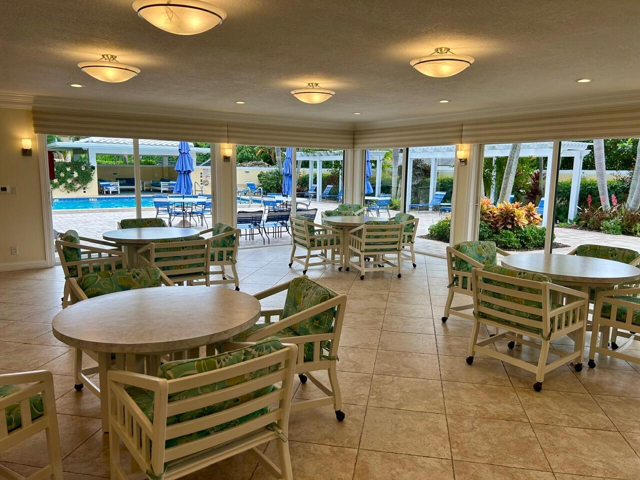 1 Southeast Turtle Creek Drive, Unit B Jupiter, FL 33469 - Photo 24 of 31 a view of a dining room with furniture window and outside view