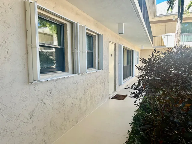 a view of a building with a yard