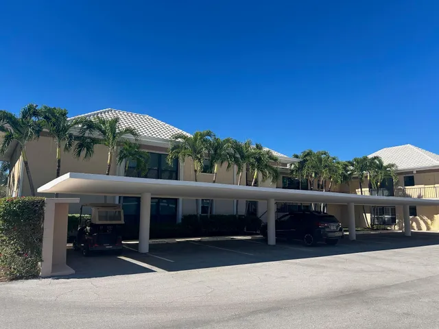 a living room with fish tank and a bookshelf