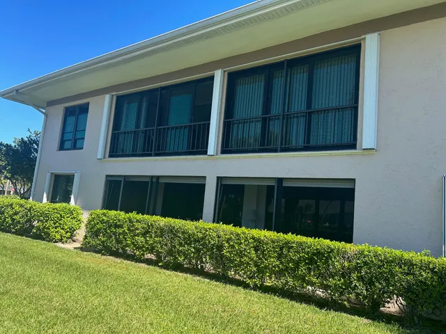 a kitchen with stainless steel appliances granite countertop a refrigerator stove top oven and sink