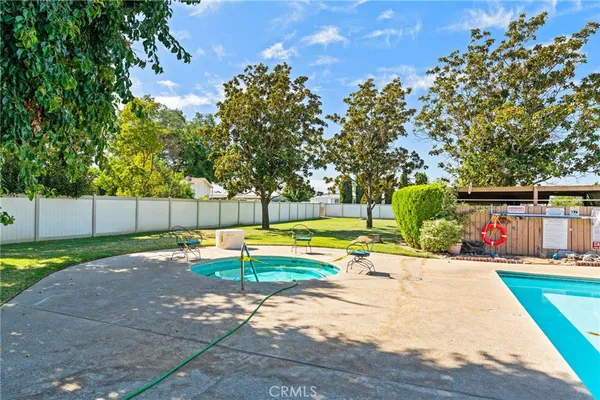 a view of a swimming pool with a patio