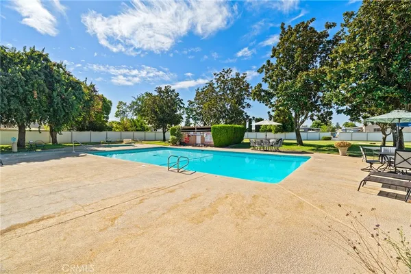 a view of a swimming pool with a yard