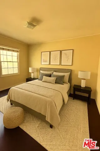 a bedroom with a bed and lamps