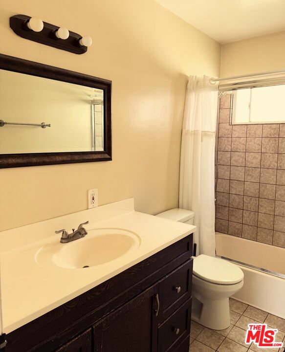 1242 Smithwood Drive, Unit 4 Los Angeles, CA 90035 - Photo 10 of 10 a bathroom with a sink a toilet and shower