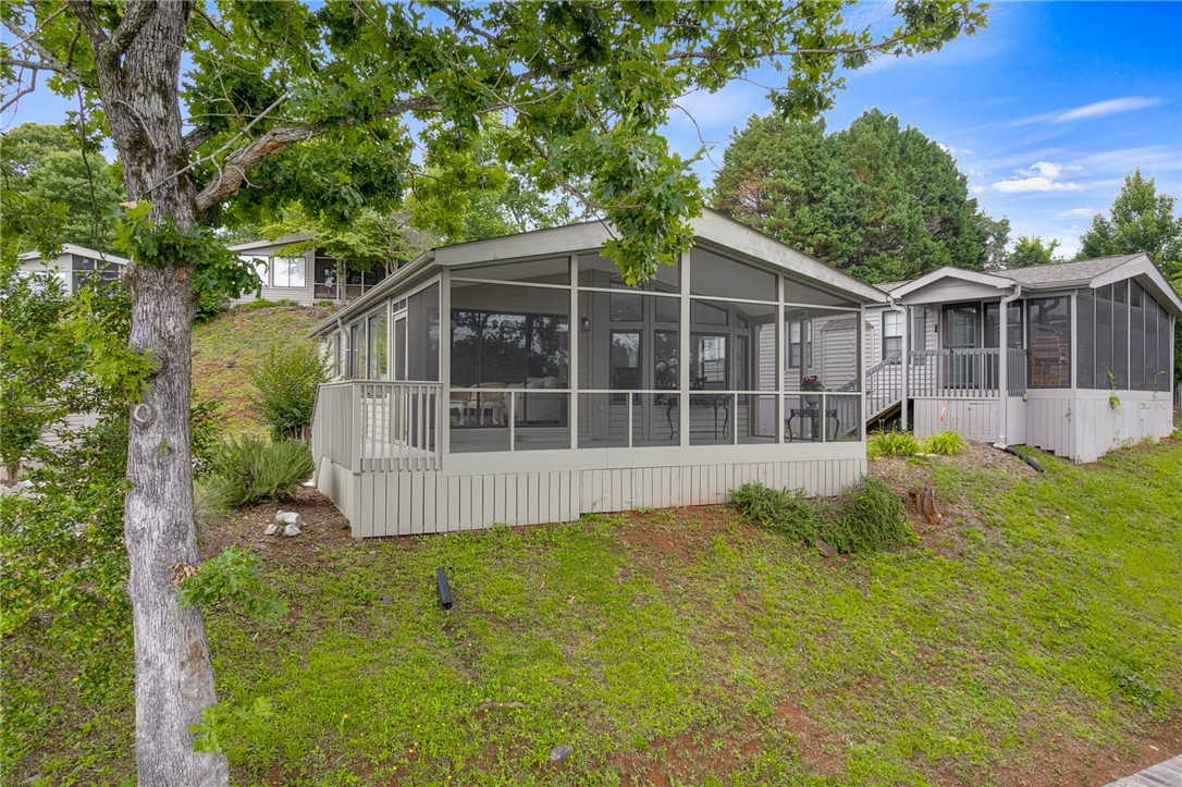 1230 Melton Road, Unit 30 West Union, SC 29696 - Photo 40 of 42 A screened porch and deck beckon outdoor living with a tranquil, elevated view.
