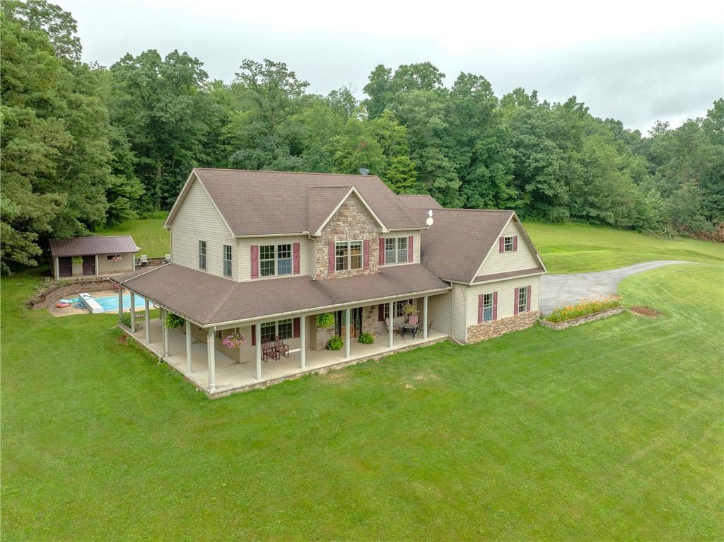 a aerial view of a house with a big yard