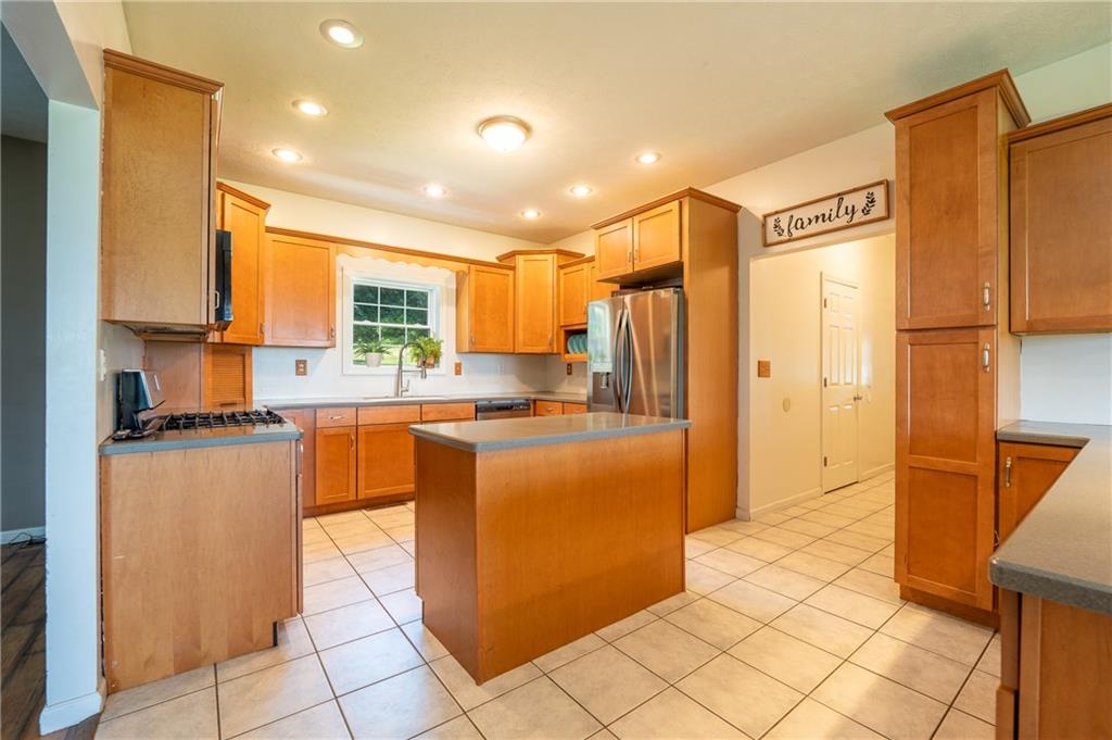 387 George Lane Seward, PA 15954 - Photo 13 of 45 a large kitchen with stainless steel appliances a refrigerator and a stove top oven