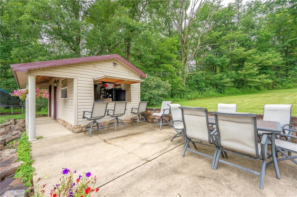 387 George Lane Seward, PA 15954 - Photo 5 of 45 a view of a patio with table and chairs and potted plants with large tree