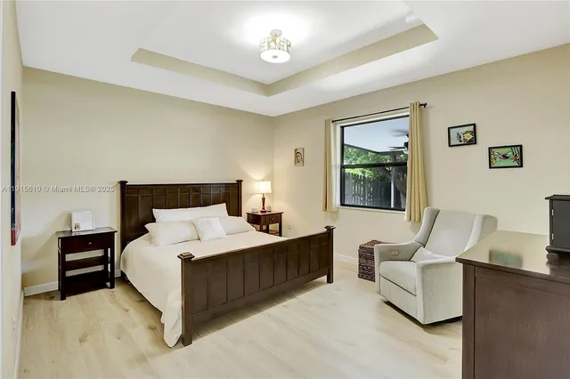 a bedroom with bed and window