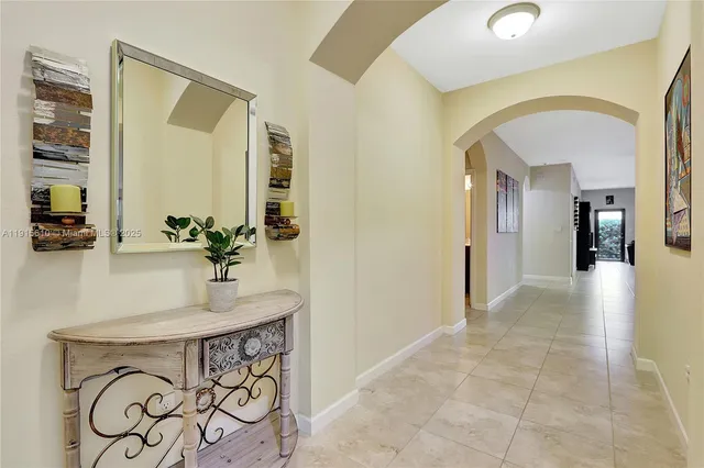 a view of bathroom with a sink and mirror