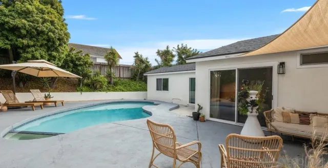 a backyard of a house with seating space