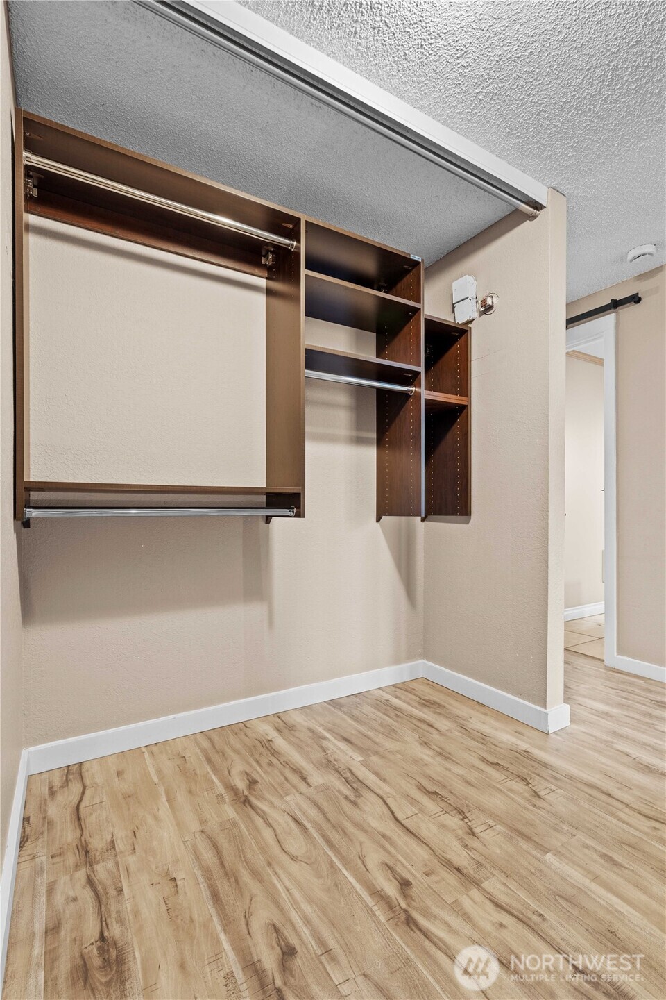 17303 Spanaway Loop Road South, Unit 4 Spanaway, WA 98387 - Photo 11 of 33 a view of a room with wooden floor