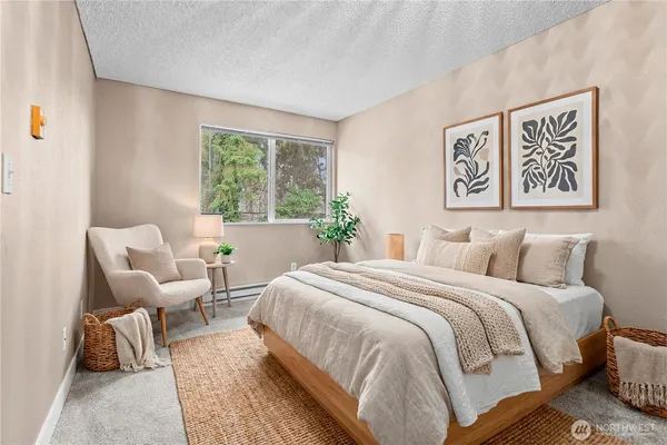 a bedroom with a bed and a couch