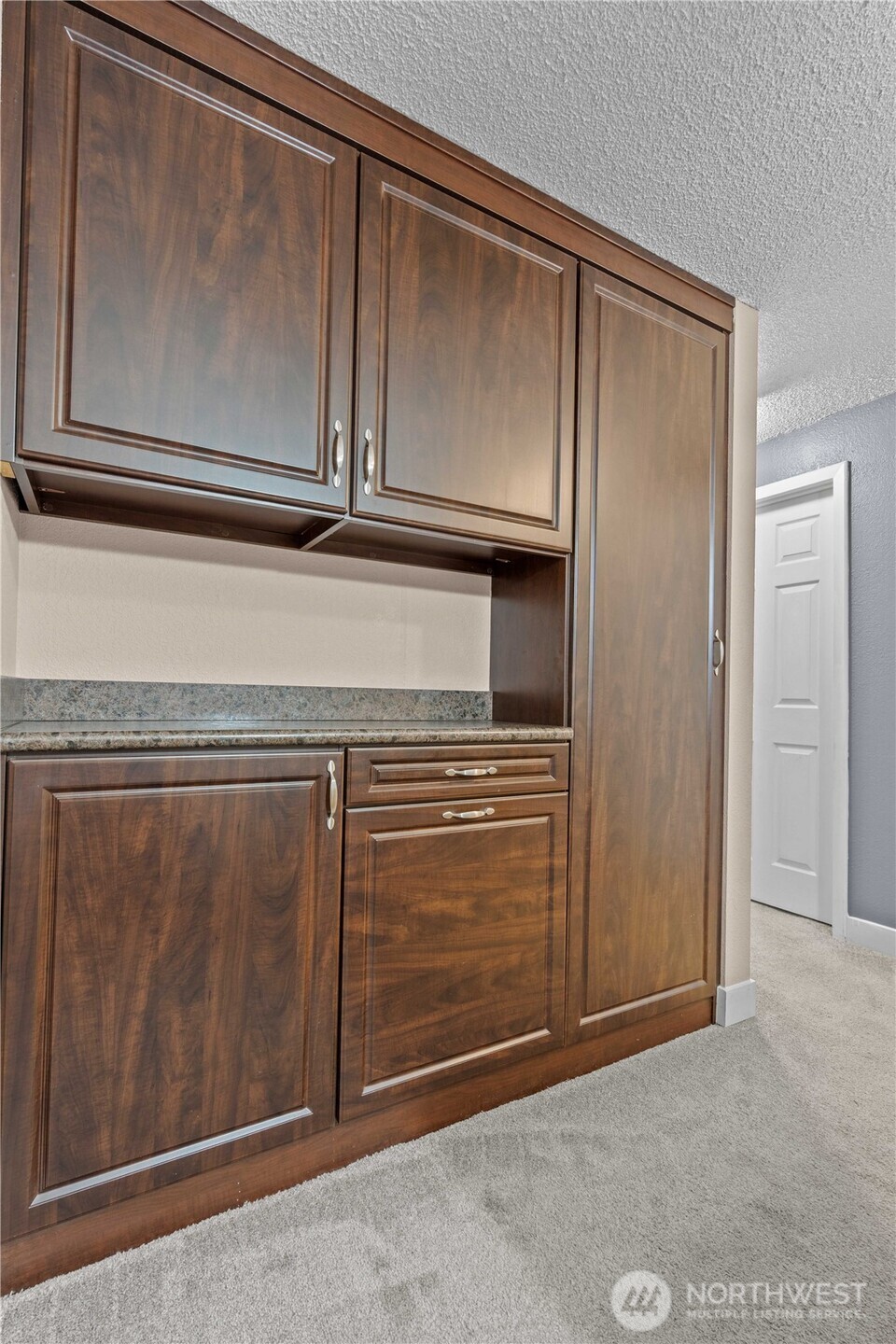 17303 Spanaway Loop Road South, Unit 4 Spanaway, WA 98387 - Photo 18 of 33 a view of a garage door