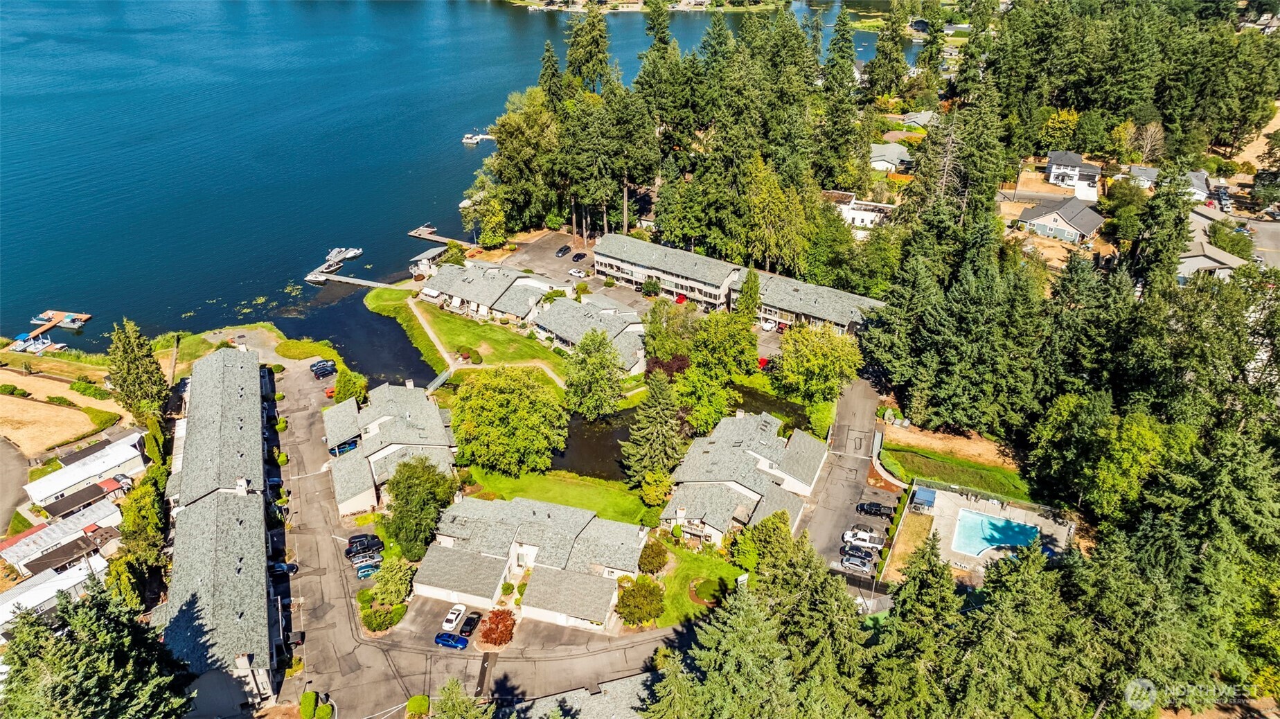 17303 Spanaway Loop Road South, Unit 4 Spanaway, WA 98387 - Photo 32 of 33 view of backyard with swimming pool and outdoor seating