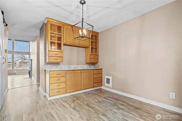 a view of a kitchen with wooden floor