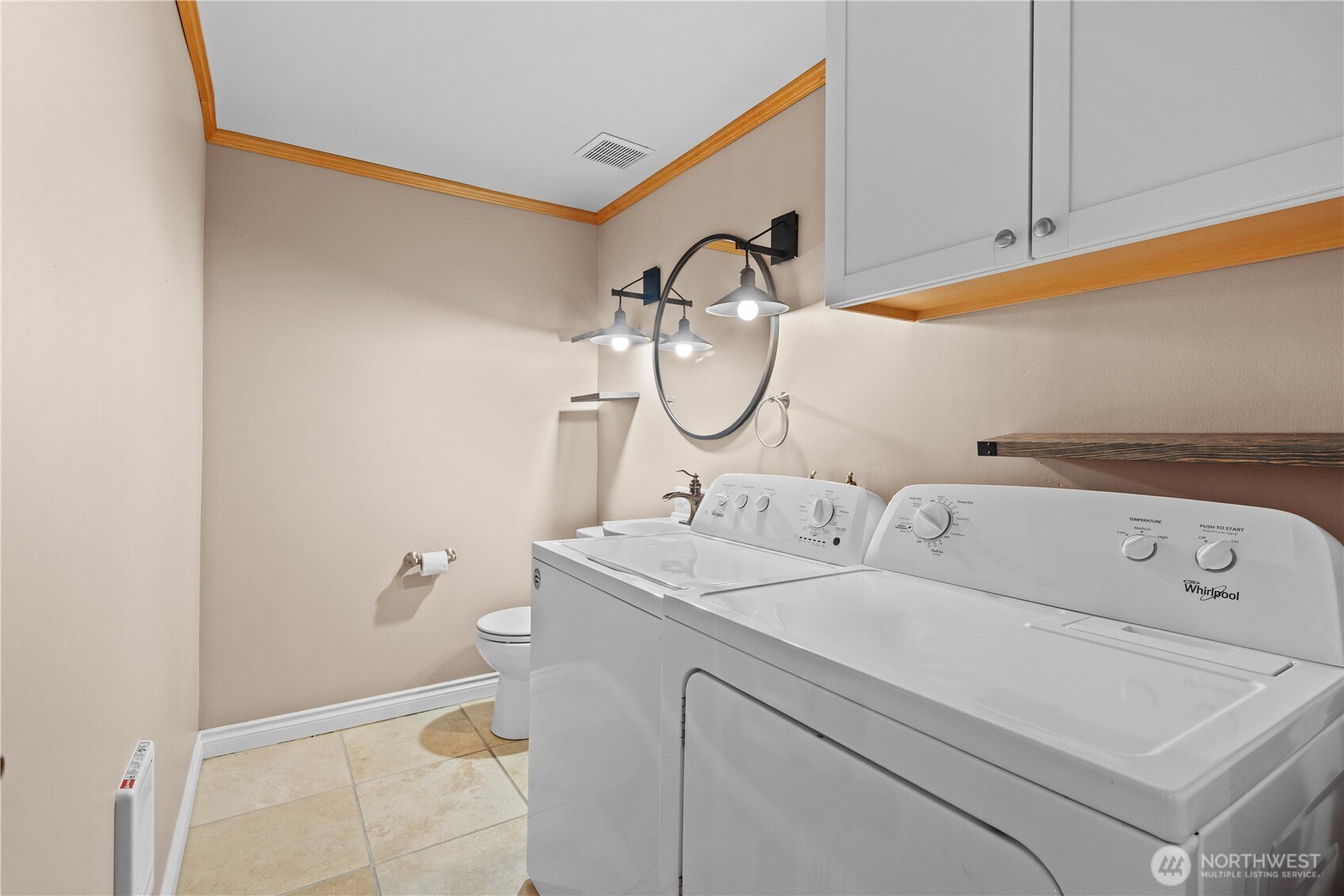 17303 Spanaway Loop Road South, Unit 4 Spanaway, WA 98387 - Photo 10 of 33 a bathroom with a sink and a mirror