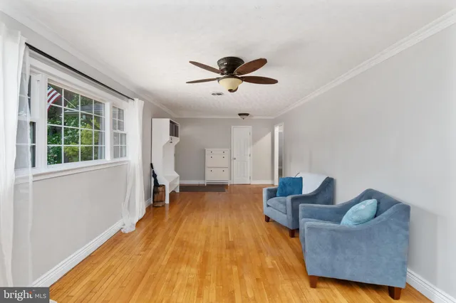 a kitchen with stainless steel appliances granite countertop a refrigerator a sink and a stove