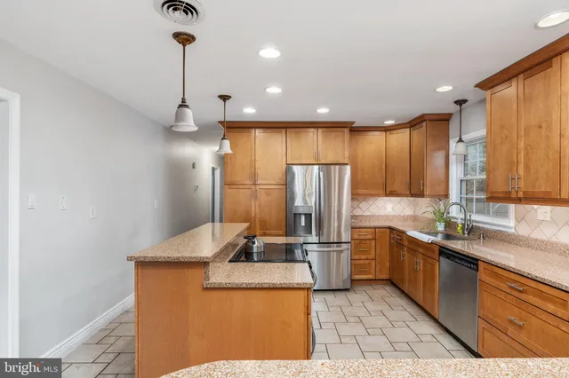 a dining room with furniture a window and a chandelier