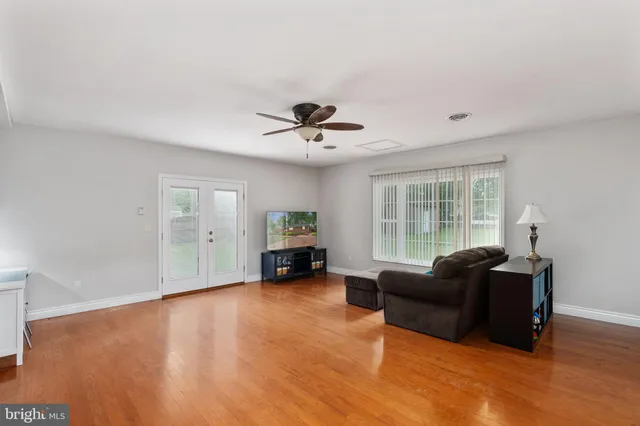 a view of an empty room and wooden floor