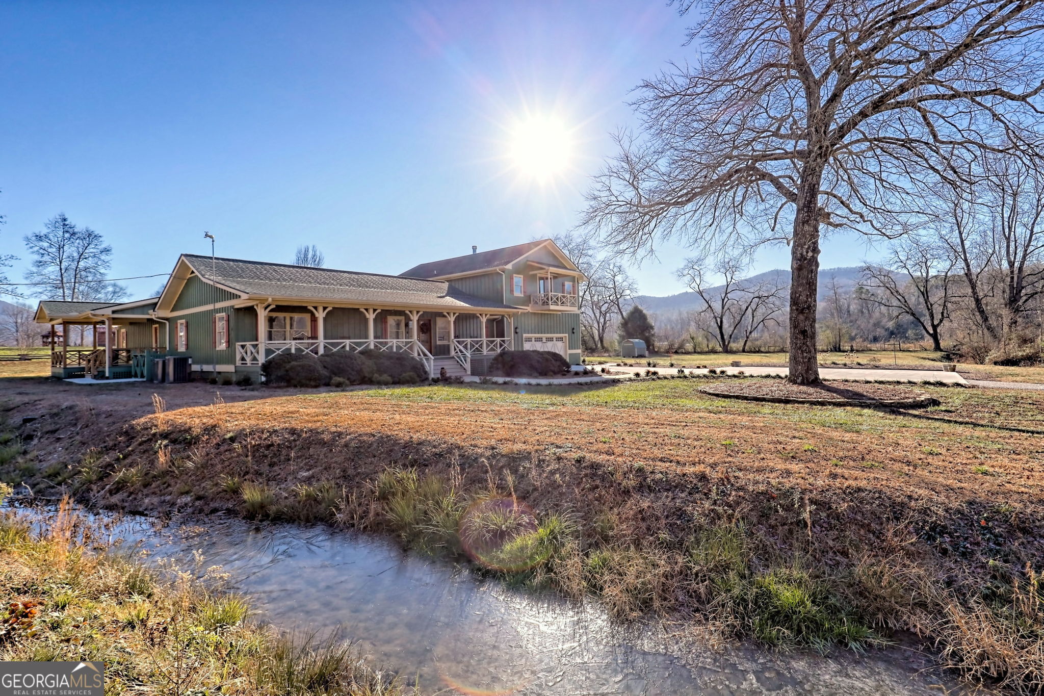 784 Wolffork Church Road Rabun Gap, GA 30568 - Photo 2 of 31 a view of swimming pool with outdoor seating and covered with trees