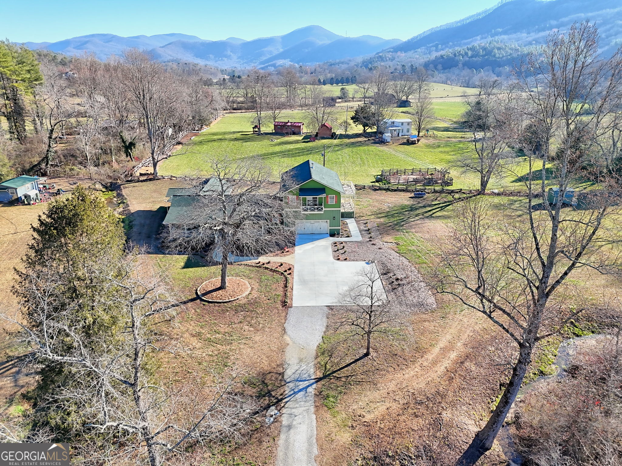 784 Wolffork Church Road Rabun Gap, GA 30568 - Photo 4 of 31 a view of a lake with a mountain in the back
