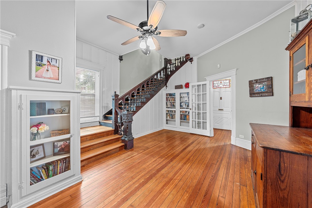 702 North 15th Street Waco, TX 76707 - Photo 11 of 45 a view of a livingroom with furniture stairs wooden floor and staircase