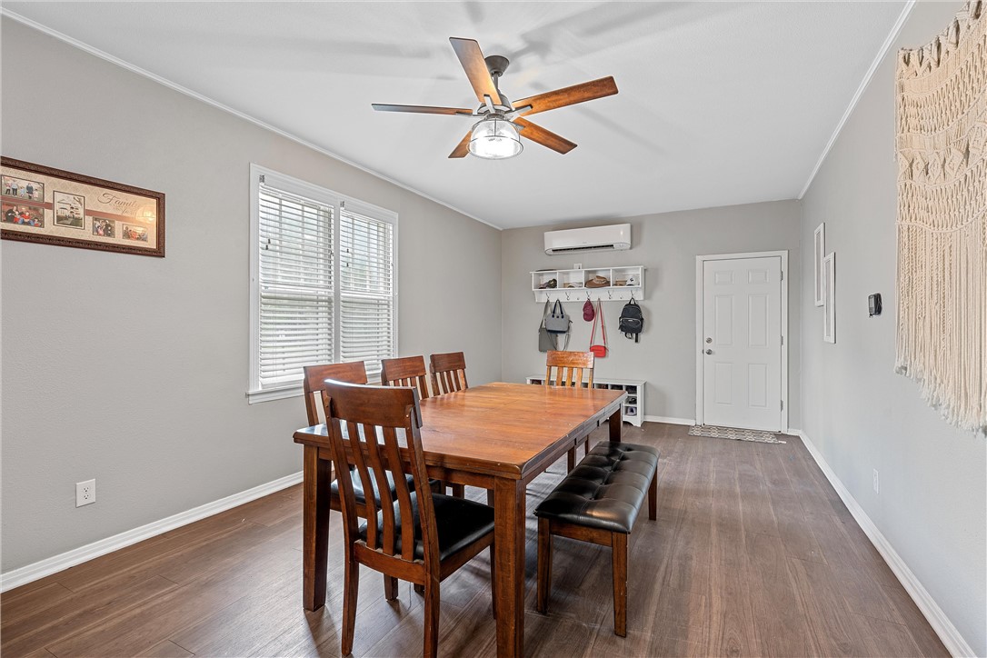 702 North 15th Street Waco, TX 76707 - Photo 17 of 45 a view of a dining room with furniture and wooden floor