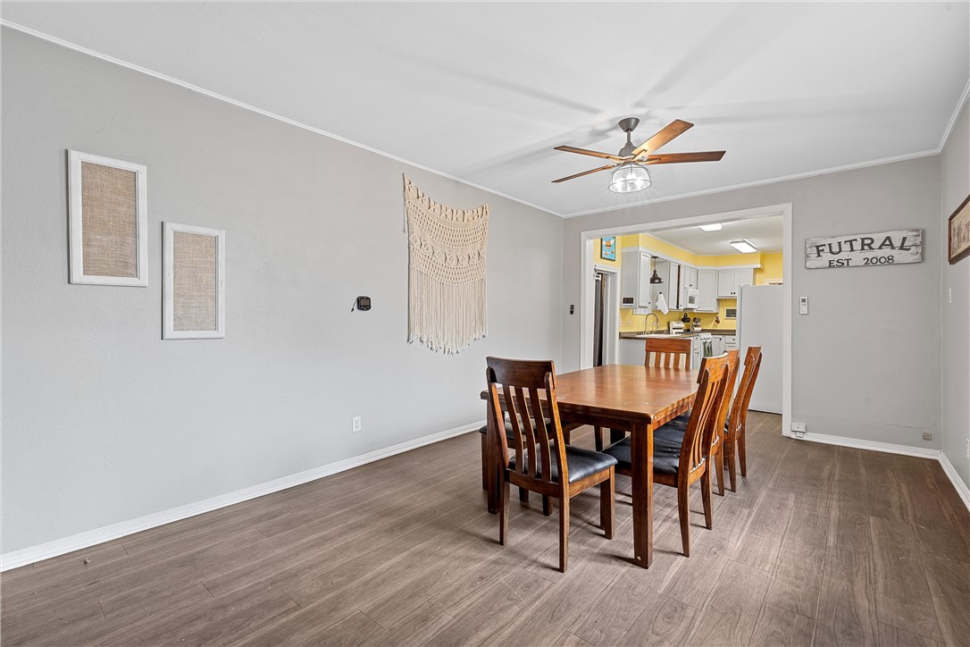 702 North 15th Street Waco, TX 76707 - Photo 18 of 45 a view of a dining room with furniture and wooden floor