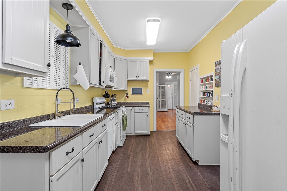 702 North 15th Street Waco, TX 76707 - Photo 19 of 45 a large kitchen with a sink and cabinets
