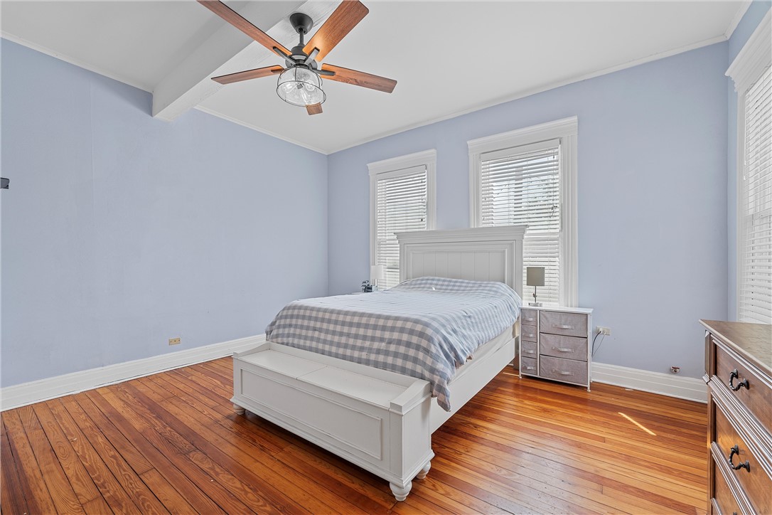 702 North 15th Street Waco, TX 76707 - Photo 25 of 45 a bedroom with a bed and a ceiling fan