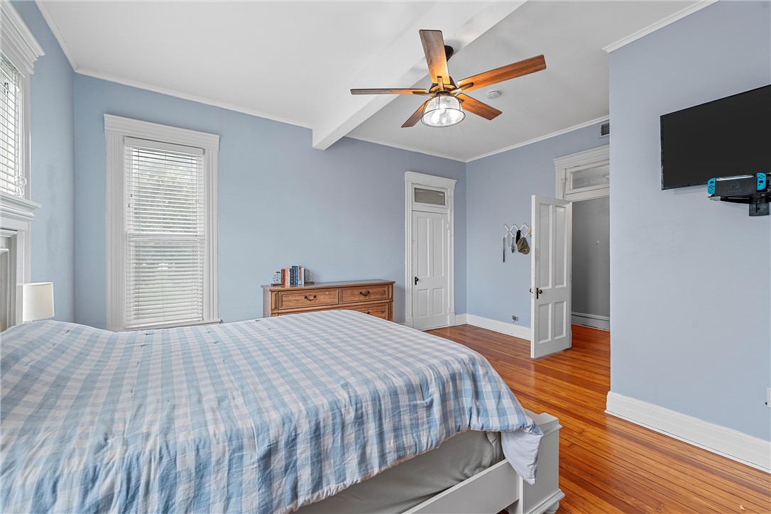 702 North 15th Street Waco, TX 76707 - Photo 26 of 45 a bedroom with a bed and a flat screen tv