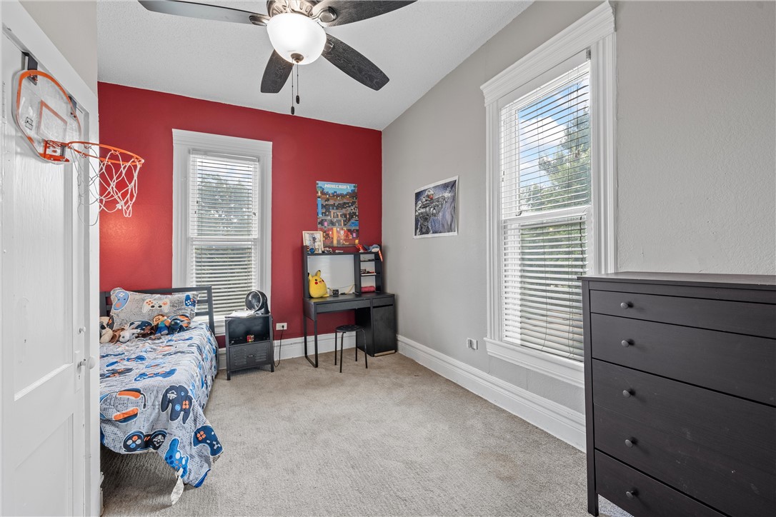 702 North 15th Street Waco, TX 76707 - Photo 30 of 45 a bedroom with a bed and a window