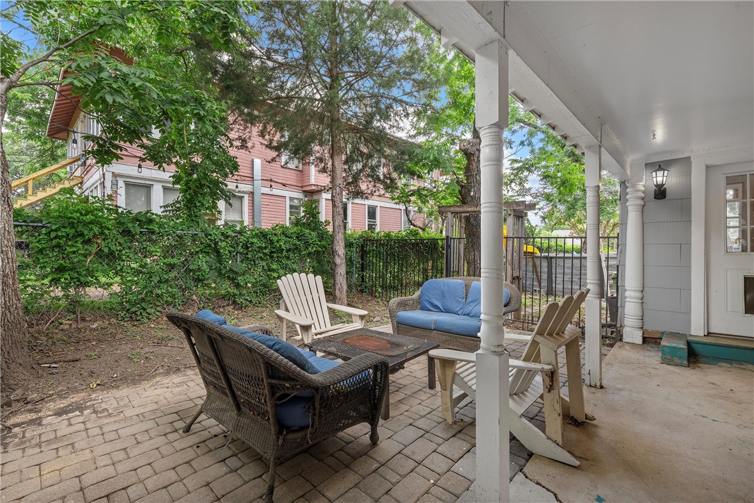 702 North 15th Street Waco, TX 76707 - Photo 35 of 45 a view of a patio with table and chairs and wooden fence