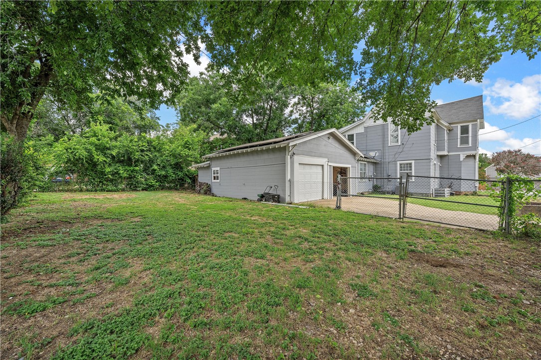 702 North 15th Street Waco, TX 76707 - Photo 38 of 45 a view of a house with backyard and trees
