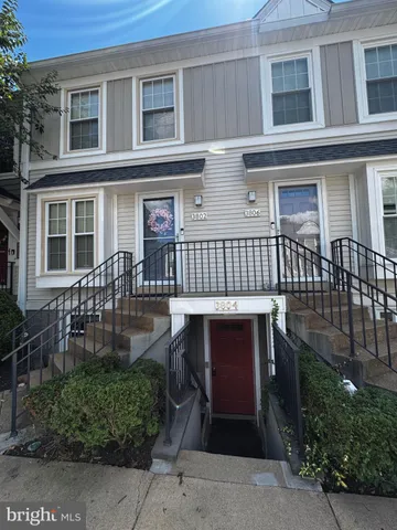 a view of front door of house with deck