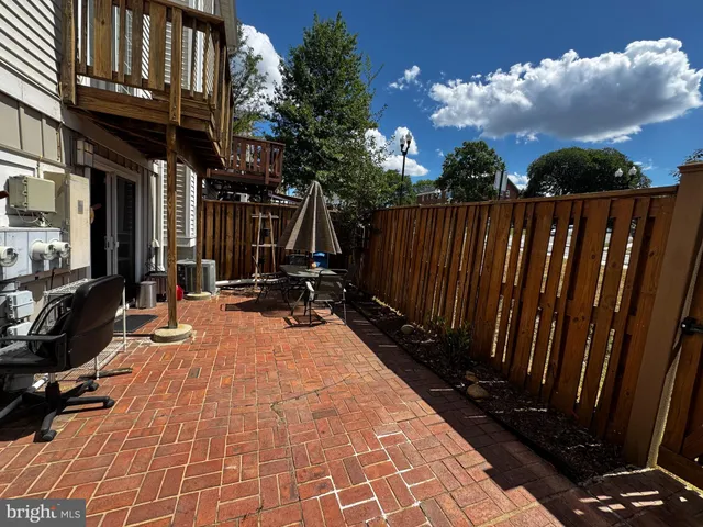 a view of outdoor space with wooden floor