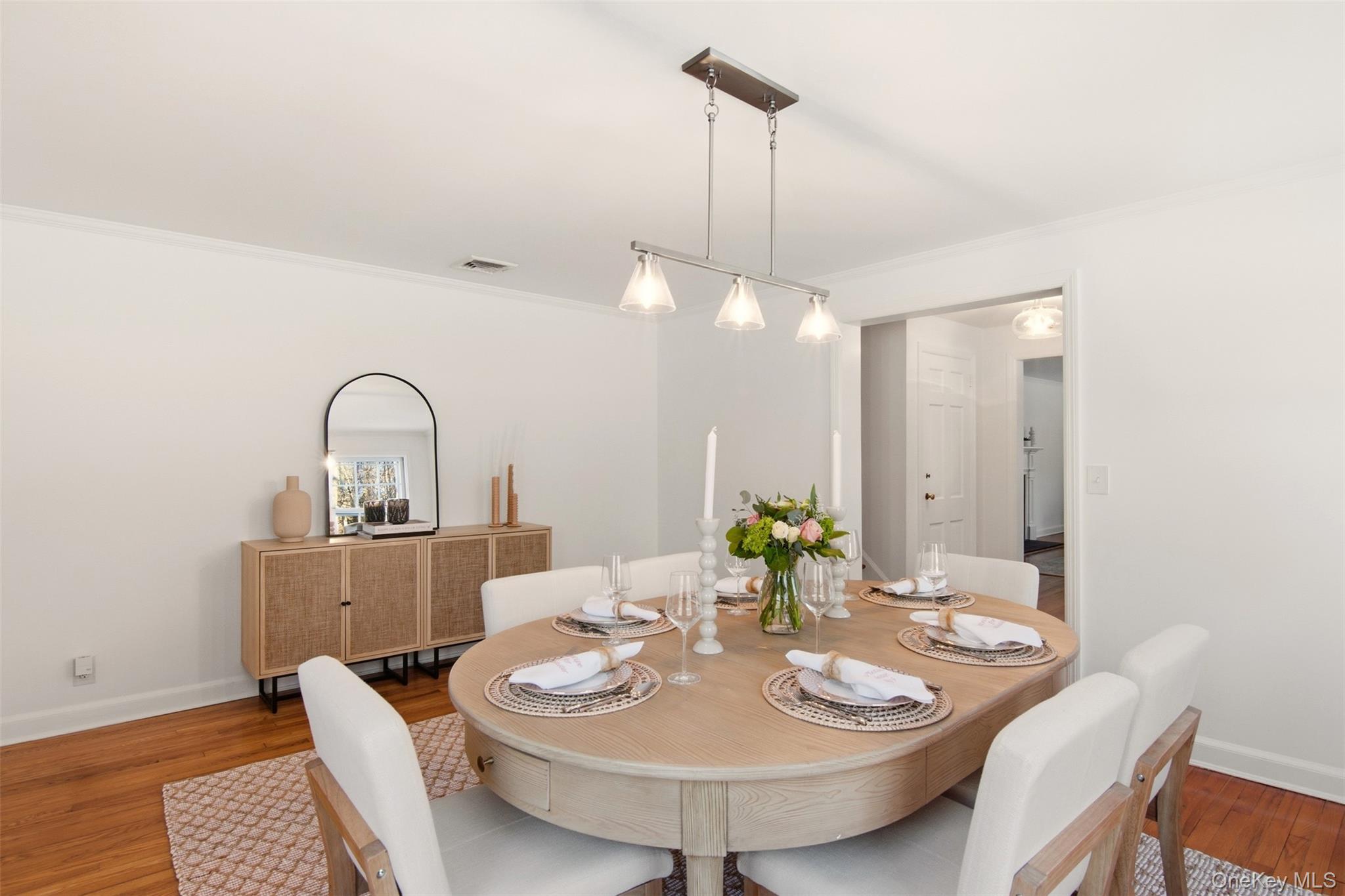 55 White Hill Road Cold Spring Harbor, NY 11724 - Photo 7 of 13 a dining room with a table and chairs
