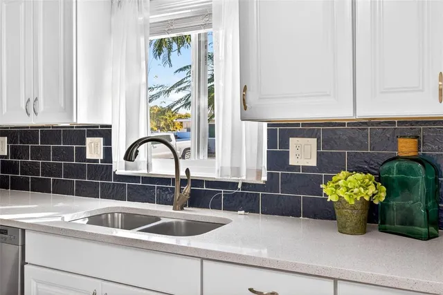 a kitchen with a sink and a window