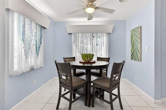 a view of a dining room with furniture and a window
